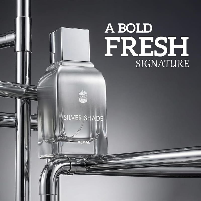 Ajmal Silver Shade bottle against chrome pipes, captioned A Bold Fresh Signature
