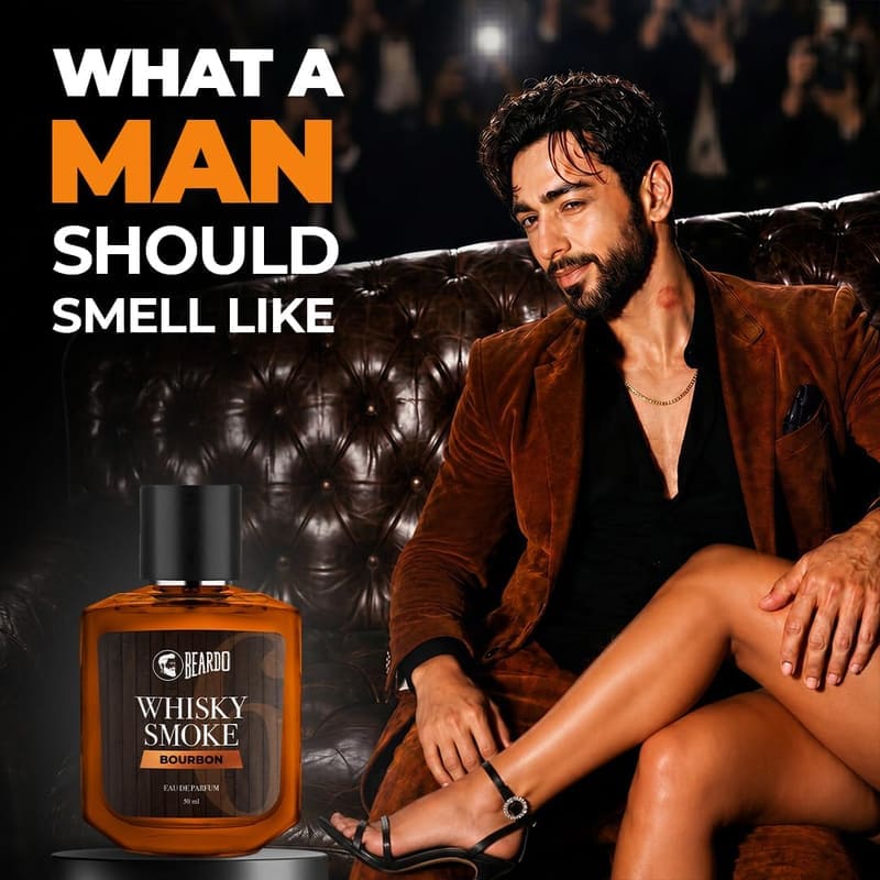 Man in a velvet jacket on a leather sofa with the Beardo Whisky Smoke Bourbon bottle, captioned What a Man Should Smell Like