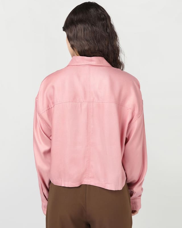 Front view of the Bewakoof Onion Pink applique crop shirt showing full-sleeve cuffs, curved hem and the second applique patch on the front panel