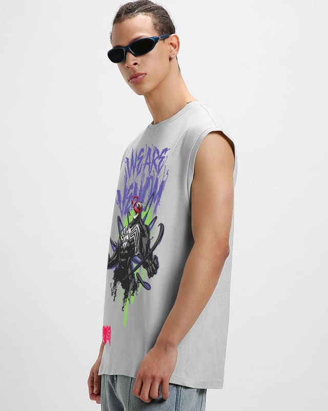 Bewakoof We Are Venom oversized vest full-length styling shot worn with baggy light-wash cargo jeans and chunky sneakers