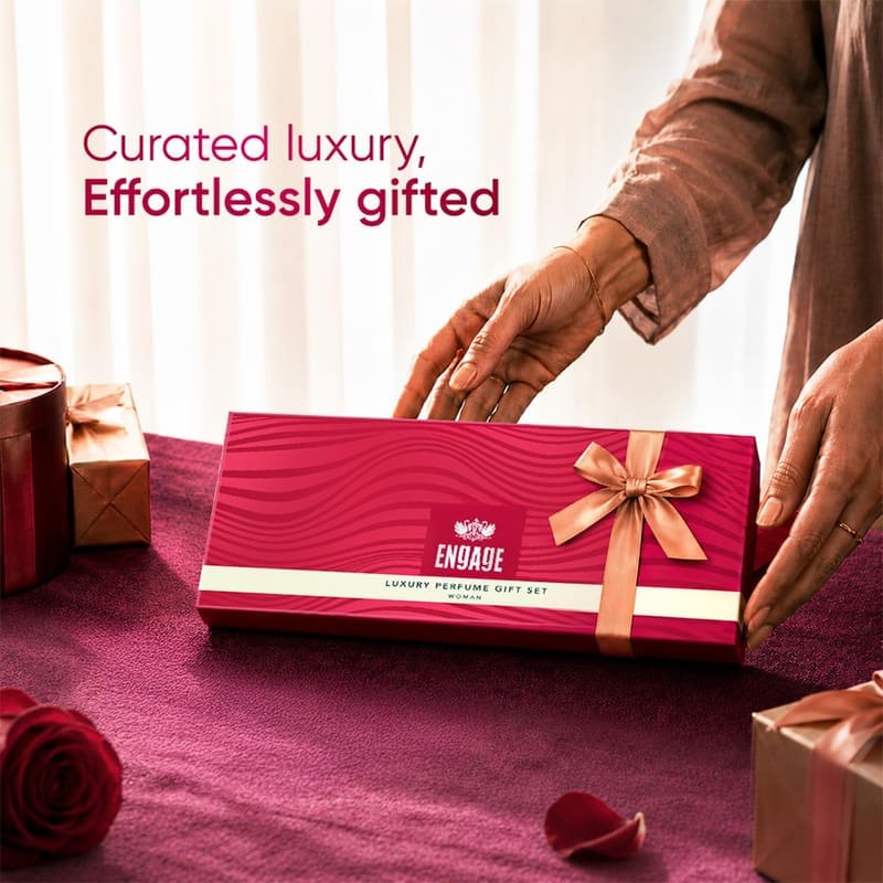 Hands presenting the wrapped Engage women's gift box, captioned Curated Luxury, Effortlessly Gifted