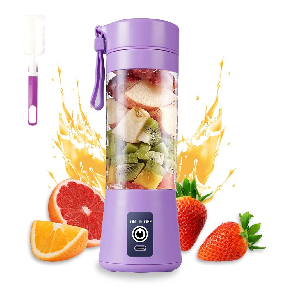 Etekcity portable blender in use on a kitchen counter — chopped fruits and a banana visible through the 380 ml transparent jar mid-blend, with the USB charging cable plugged in to the rear of the base