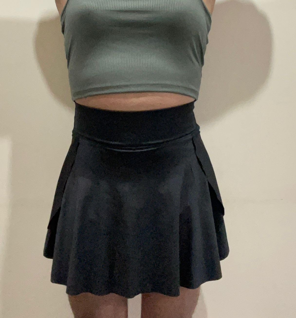 Mehrang high-waist skater skirt worn on-body in solid black showing the above-knee mini length, flattering cinched waist and full A-line silhouette