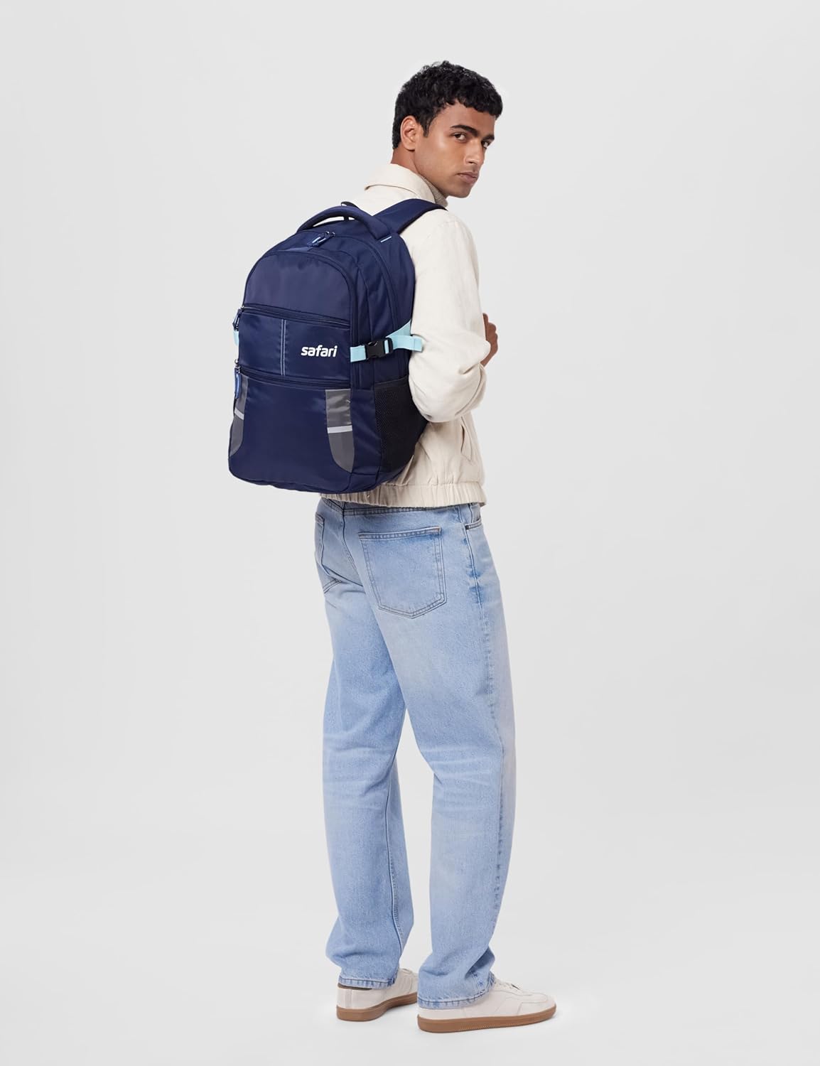 Safari Omega backpack opened to show the padded laptop sleeve, the fleece-lined tablet sleeve, the front-panel organizer compartment with pen and card slots, and the main cargo space with internal layout