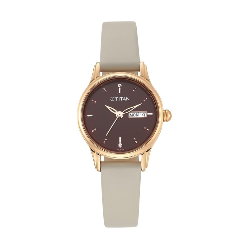 Titan 2656WL01 dial close-up showing crystal markers and the day and date window at 3 o'clock