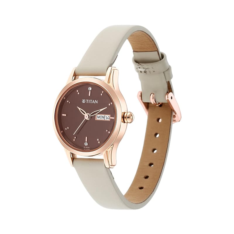 Titan 2656WL01 angled view showing the crown and tang buckle on the ivory leather strap