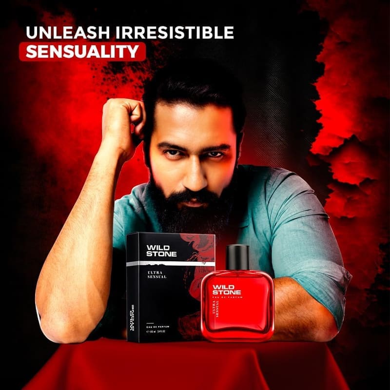 Bearded man leaning on a red table beside the Wild Stone Ultra Sensual bottle and box, captioned Unleash Irresistible Sensuality