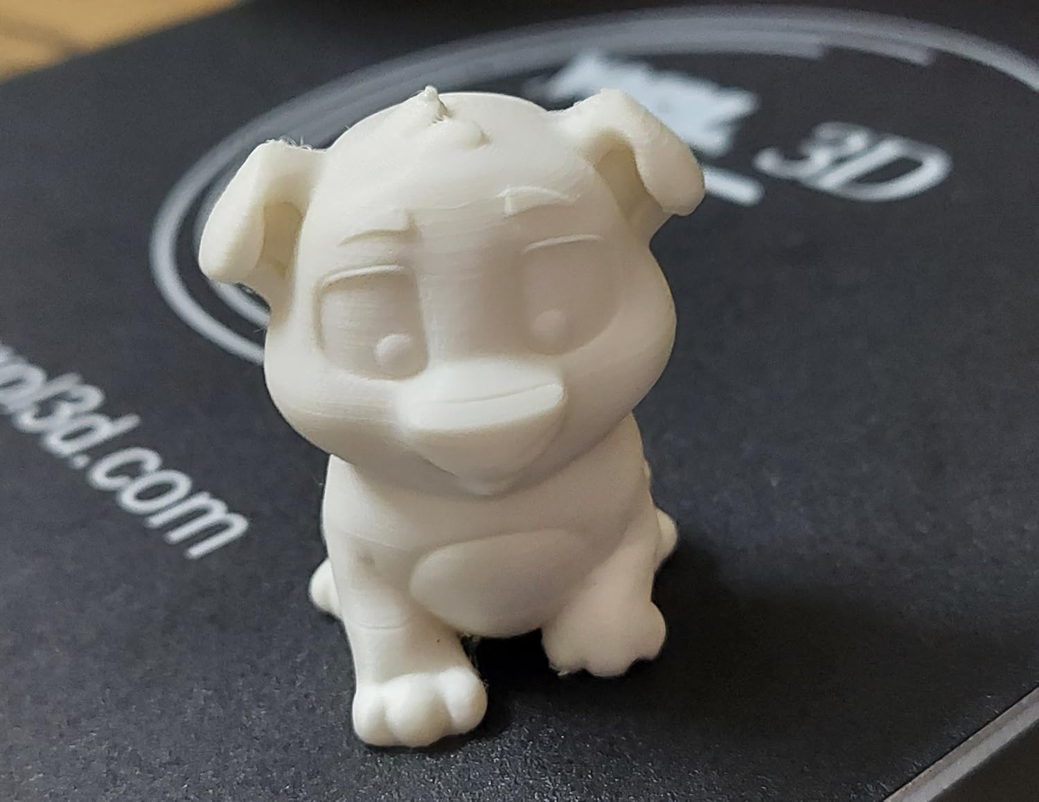 Fully assembled WOL3D Ender 3 on a wooden desk with the heated bed, Bowden MK-8 extruder, knob-LCD display and filament spool mounted on top — Indian buyer setup
