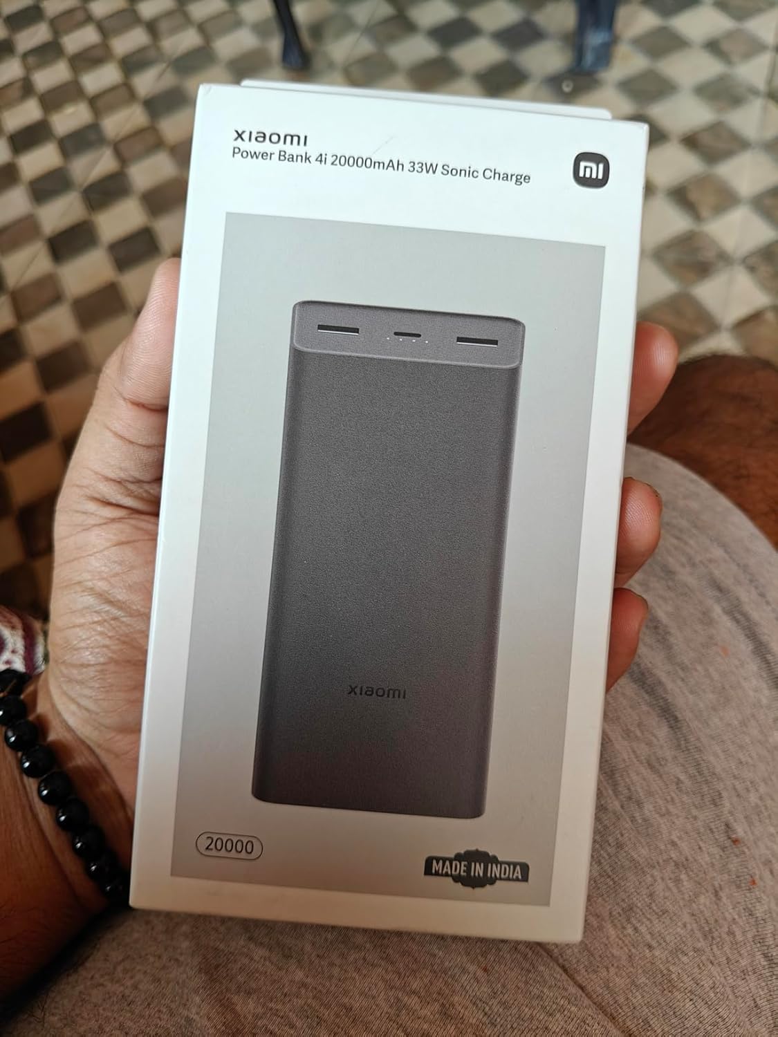 Xiaomi Power Bank 4i 20000mAh front view showing the four-LED capacity gauge and brand label